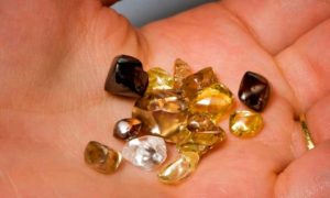 Photo of crystals in an open hand.