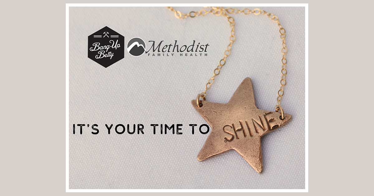 Photo of a star-shaped necklace with the word SHINE printed on it